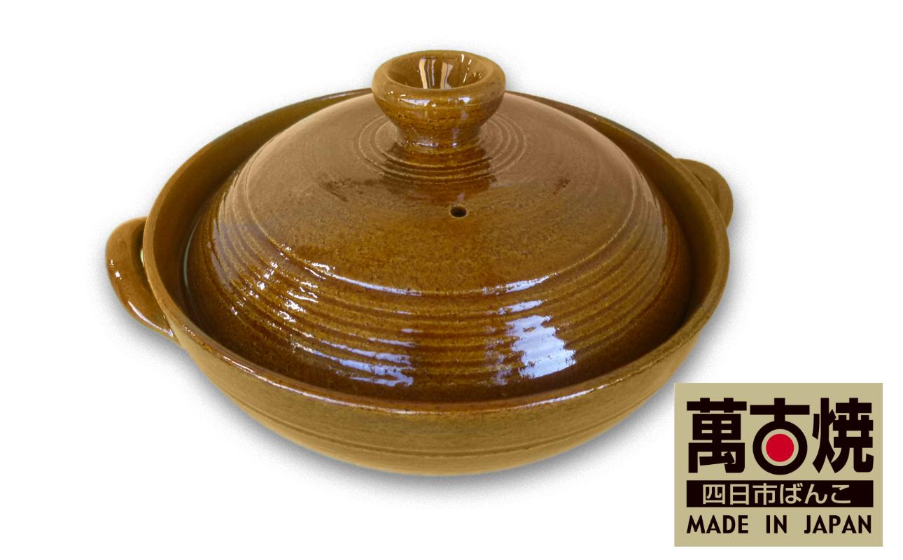 鮮やかな飴色で丸いフタ付き土鍋